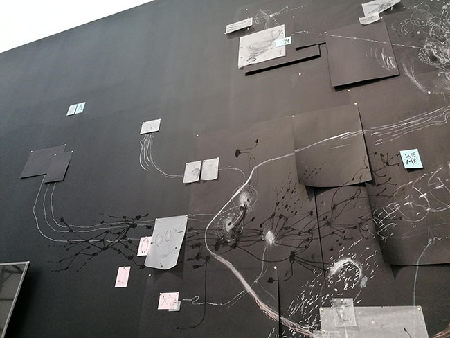 Nikolaus Gansterer, Following the Fold, 2019, drawings in various dimensions pinned on a black wall, approx. 600 x 300 cm, installation view, Talbot Rice Gallery, Edinburgh