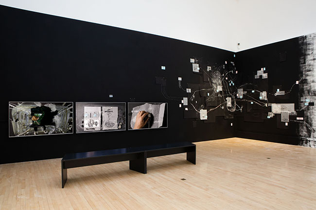 Nikolaus Gansterer, Following the Fold, 2019, drawings in various dimensions pinned on a black wall, approx. 600 x 300 cm, installation view, Talbot Rice Gallery, Edinburgh