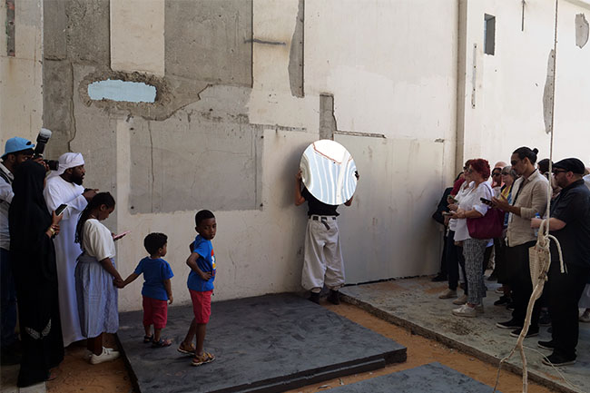 Nikolaus Gansterer, Sympoiesis Obersatory, 2019, performance at site specific installation with found materials, mirrors, bamboo, wood, wire, sound, video, 14th Sharjah Biennial, Ice Factory, Kalba, UAE