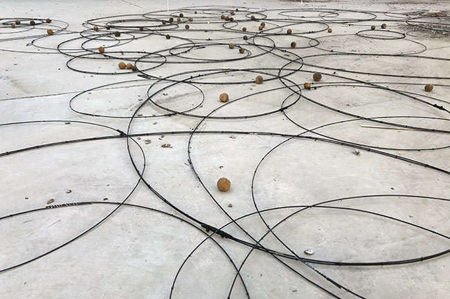 Nikolaus Gansterer, Sympoiesis Obersatory, 2019, floor drawing at site specific installation with found materials, mirrors, bamboo, wood, wire, sound, video, 14th Sharjah Biennial, Ice Factory, Kalba, UAE